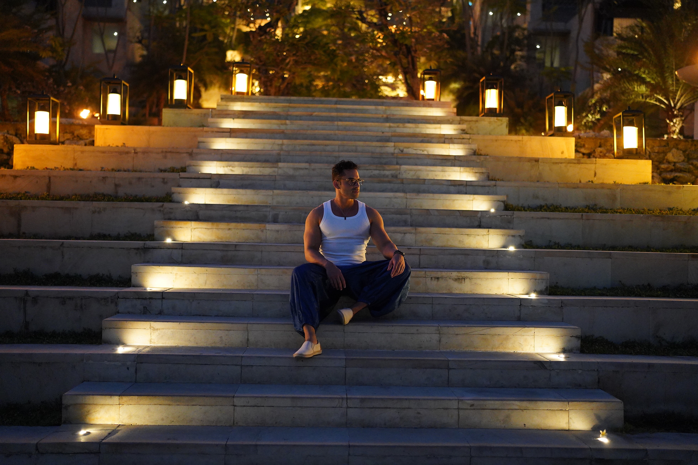 H. Rossi at an illuminated luxury resort staircase